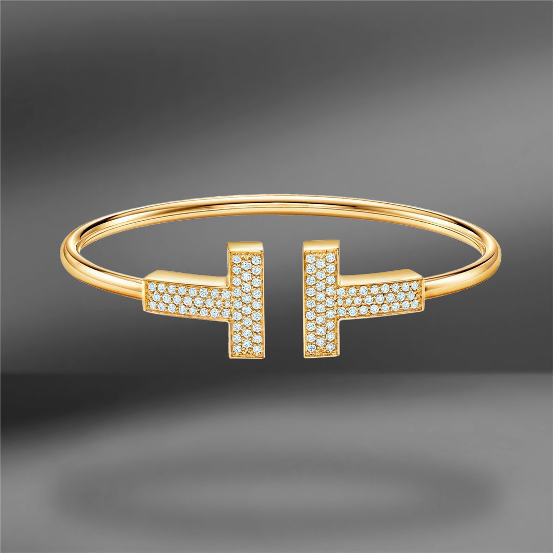 продажа Золотой браслет с бриллиантами Tiffany & Co. T в салоне «Emporium Gold»