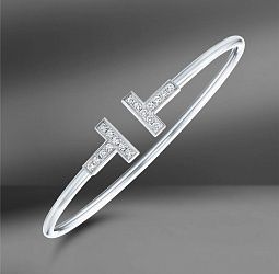 продажа Золотой браслет с бриллиантами 0.24 Ct Tiffany & Co. “T” в салоне «Emporium Gold»