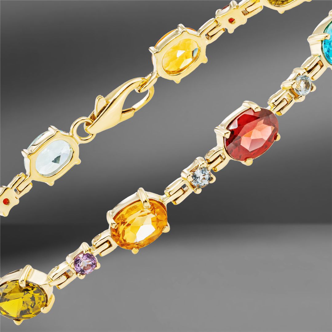 продажа Золотой браслет с цветными камнями в салоне «Emporium Gold»