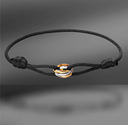 продажа Браслет на черном шнурке Cartier Trinity в салоне «Emporium Gold»